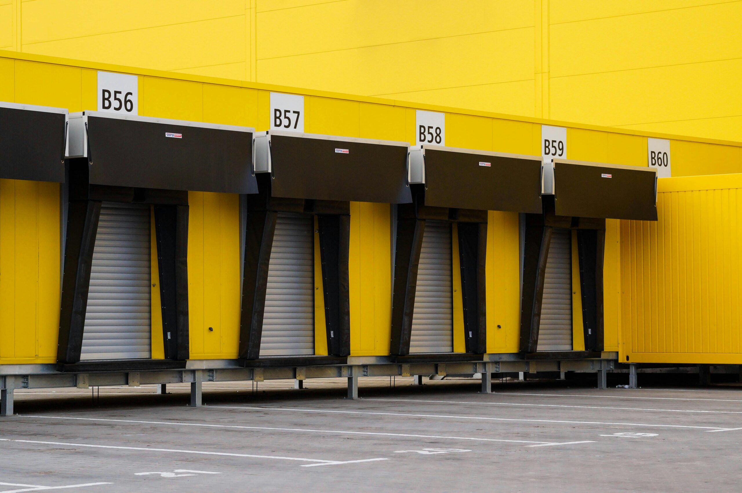 Empty loading dock doors at a warehouse facility