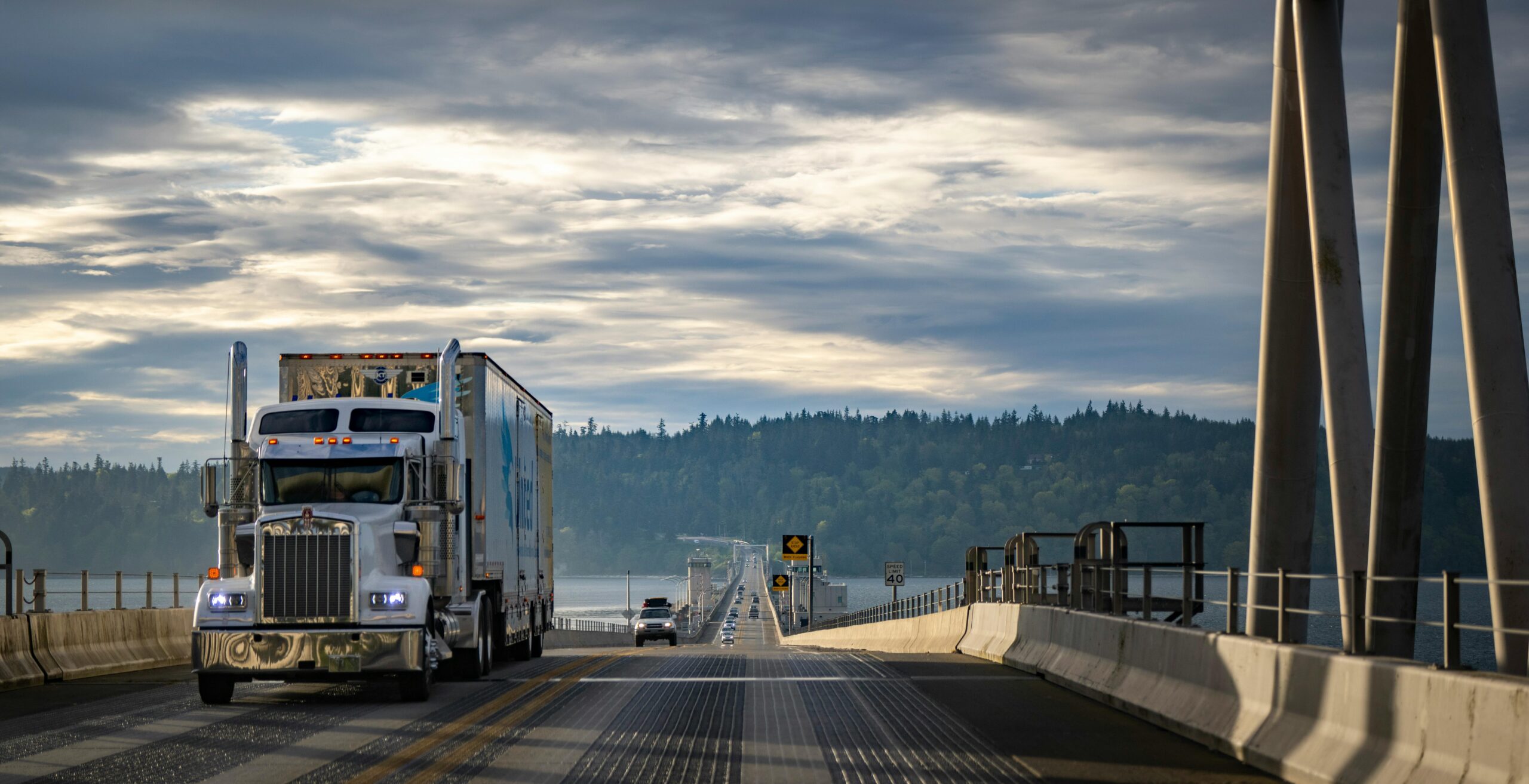 Semi truck crossing a bridge on an expedited freight route