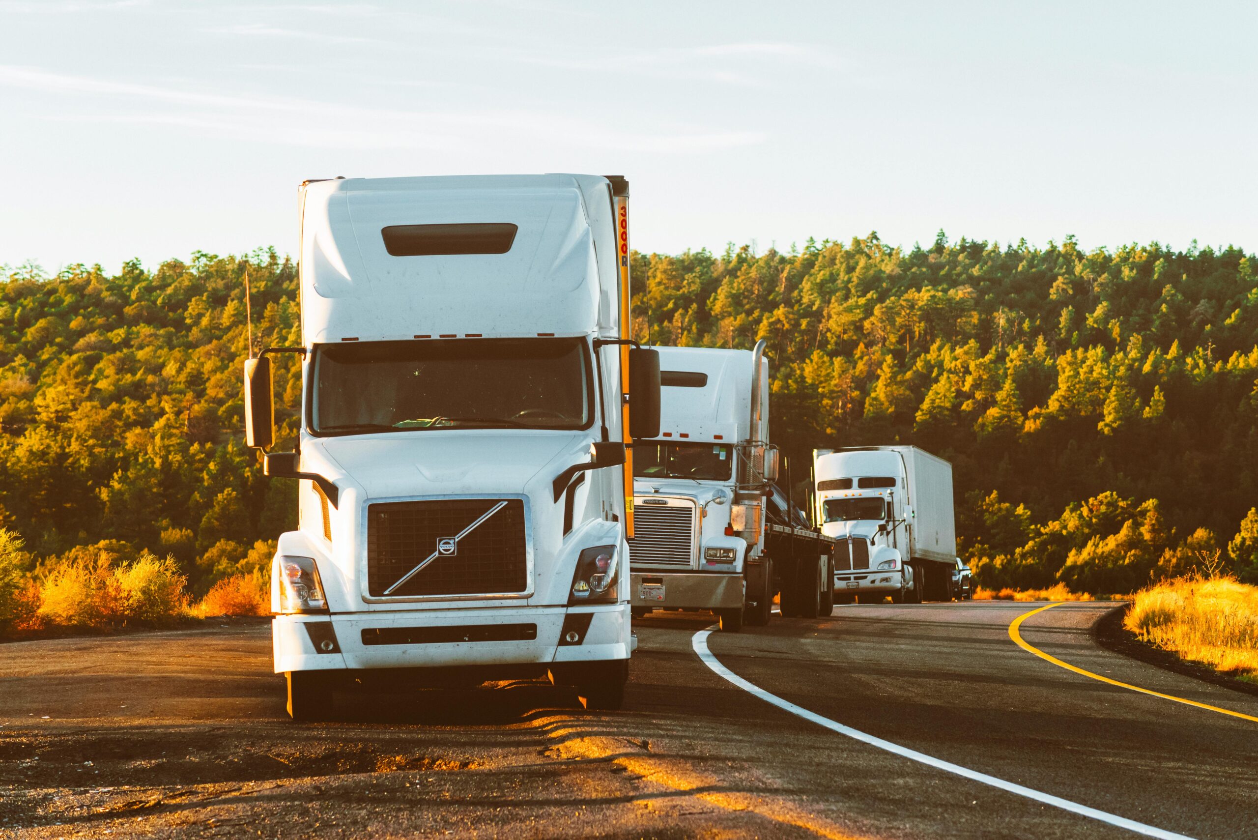 semi trucks on highway representing freight carrier network